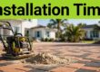 New brick paver patio with construction tools, palms, and a coastal home.