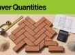 Brick pavers, a measuring tape, calculator, plan, sand, and aggregate arranged overhead.