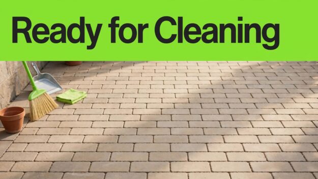 Prepared Brick Patio A broom and moved patio items leave brick pavers clear for cleaning.