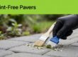 A gloved hand scrapes dried paint from a concrete paver beneath a green banner.