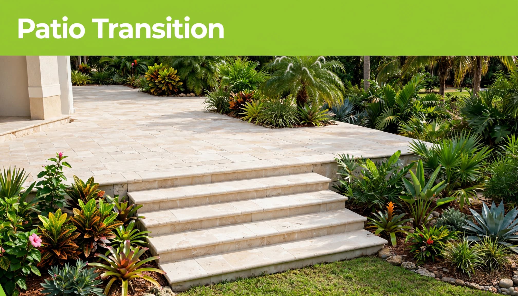 Low paver steps connect a pale stone patio to a garden terrace.